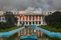 Fire rages through the Singha Durbar, the main administrative building for the Nepal government, in Kathmandu on September 9, 2025, a day after a police crackdown on demonstrations over social media prohibitions and corruption by the government. Nepali youth protesters set fire to parliament on September 9 as the veteran prime minister obeyed furious crowds to quit, a day after one of the deadliest crackdowns in years in which at least 19 people were killed.