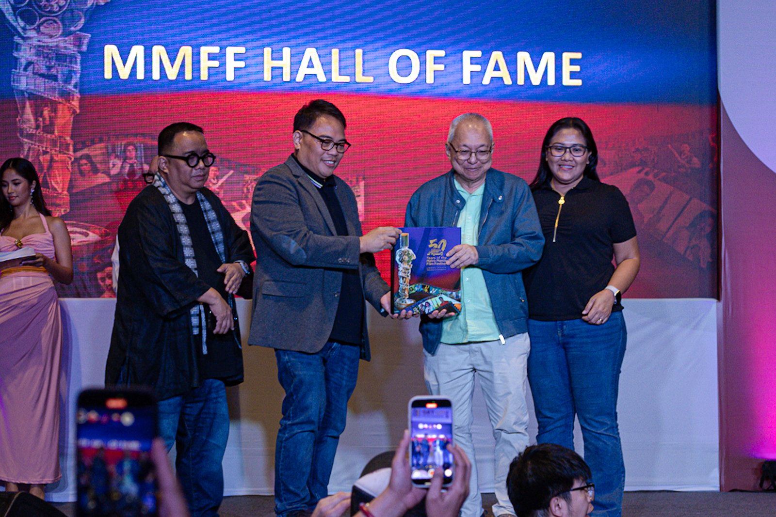 MMDA chair Atty. Don Artes formally receives the “50 Years of Metro Manila Festival” coffee table book from ABS-CBN Books president Mark Yambot during a turnover ceremony at the Manila International Book Fair 2025 in Pasay City on September 12. Multi-MMFF Best Actress winner Judy Ann Santos was also inducted into the MMFF Hall of Fame, the youngest in its 50-year history.