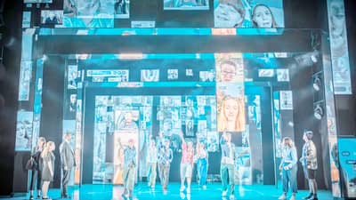 The clever use of mirrored sliding panels and a glasshouse motif — easily assembled for a touring production — amplifies the emotional impact.