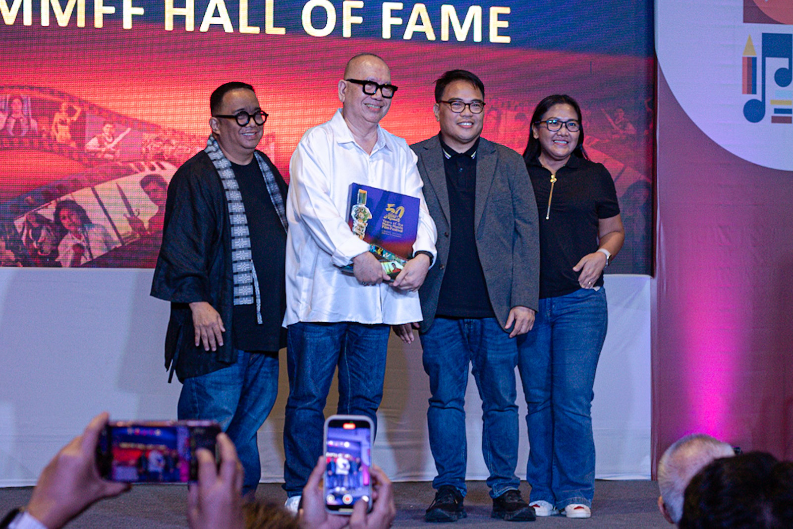 MMDA chair Atty. Don Artes formally receives the “50 Years of Metro Manila Festival” coffee table book from ABS-CBN Books president Mark Yambot during a turnover ceremony at the Manila International Book Fair 2025 in Pasay City on September 12. Multi-MMFF Best Actress winner Judy Ann Santos was also inducted into the MMFF Hall of Fame, the youngest in its 50-year history.