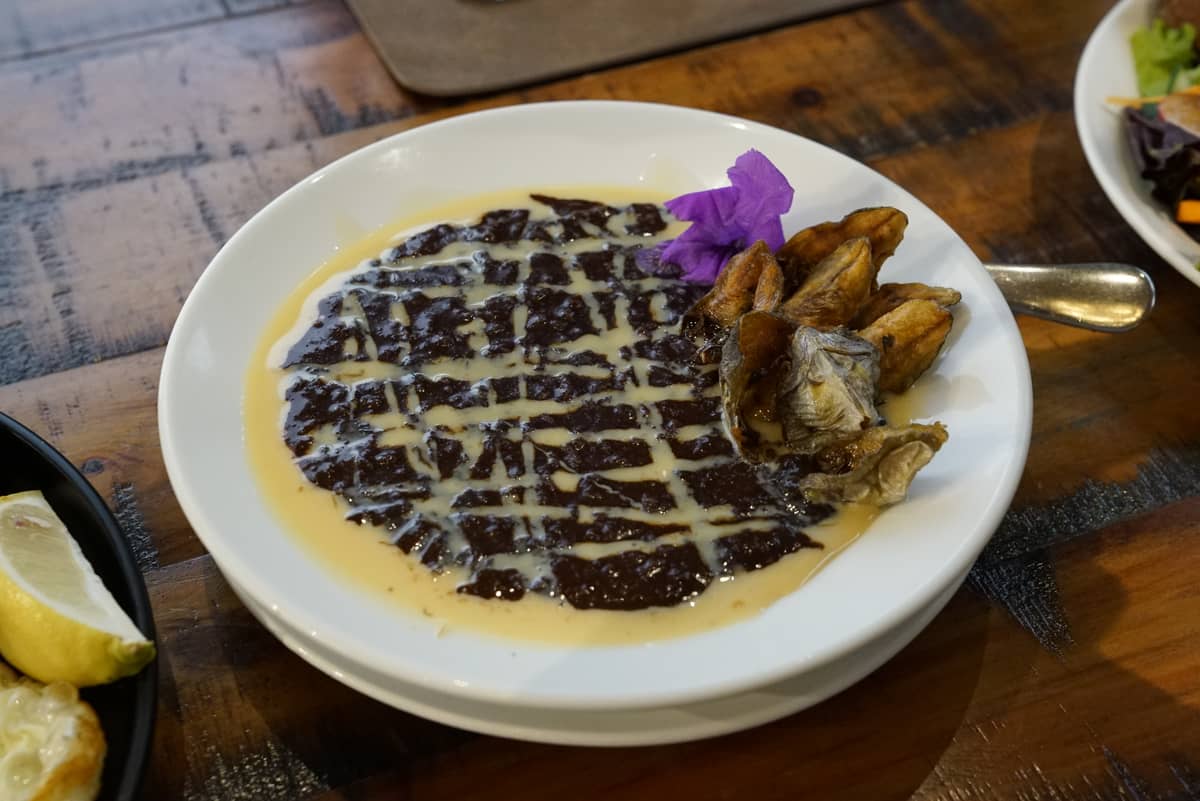 CHAMPORADO: A Filipino meal that is best to be eaten during cold weather. Made with glutinous rice, tsokolate batirol, danggit, condensed milk topped with edible flowers. A dish that satisfies your appetite and your eyes.