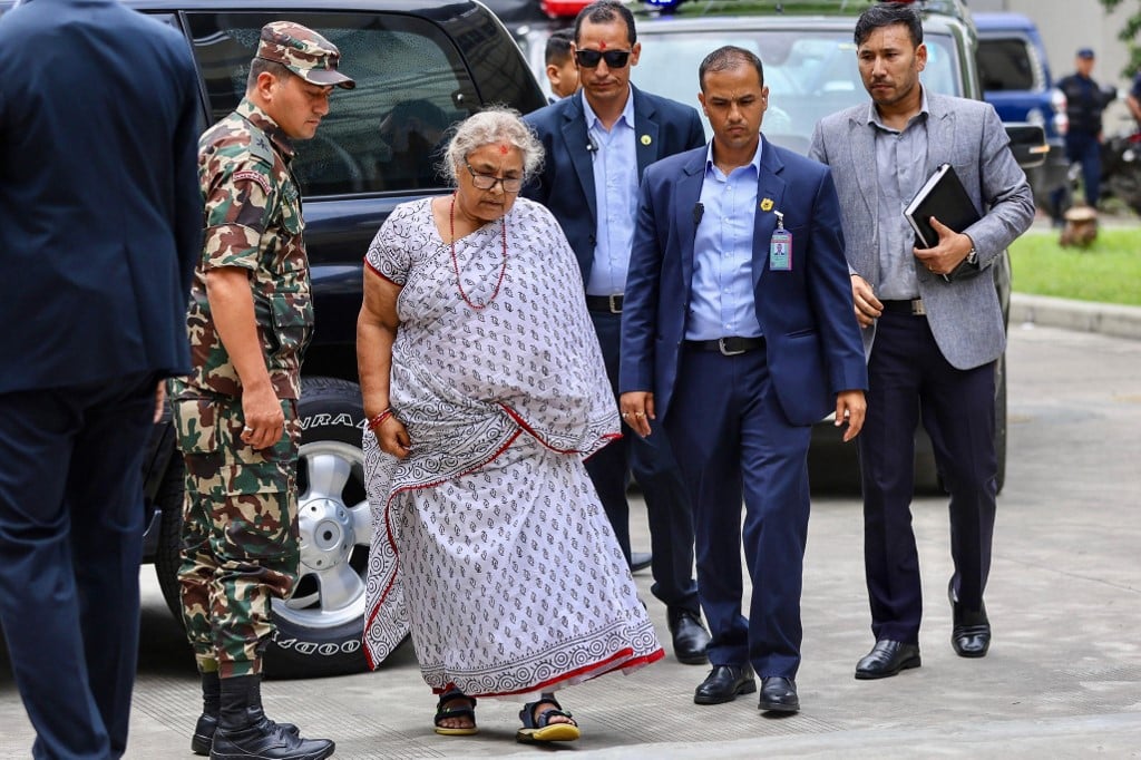 Nepal returns to calm as first woman PM takes charge, visits wounded