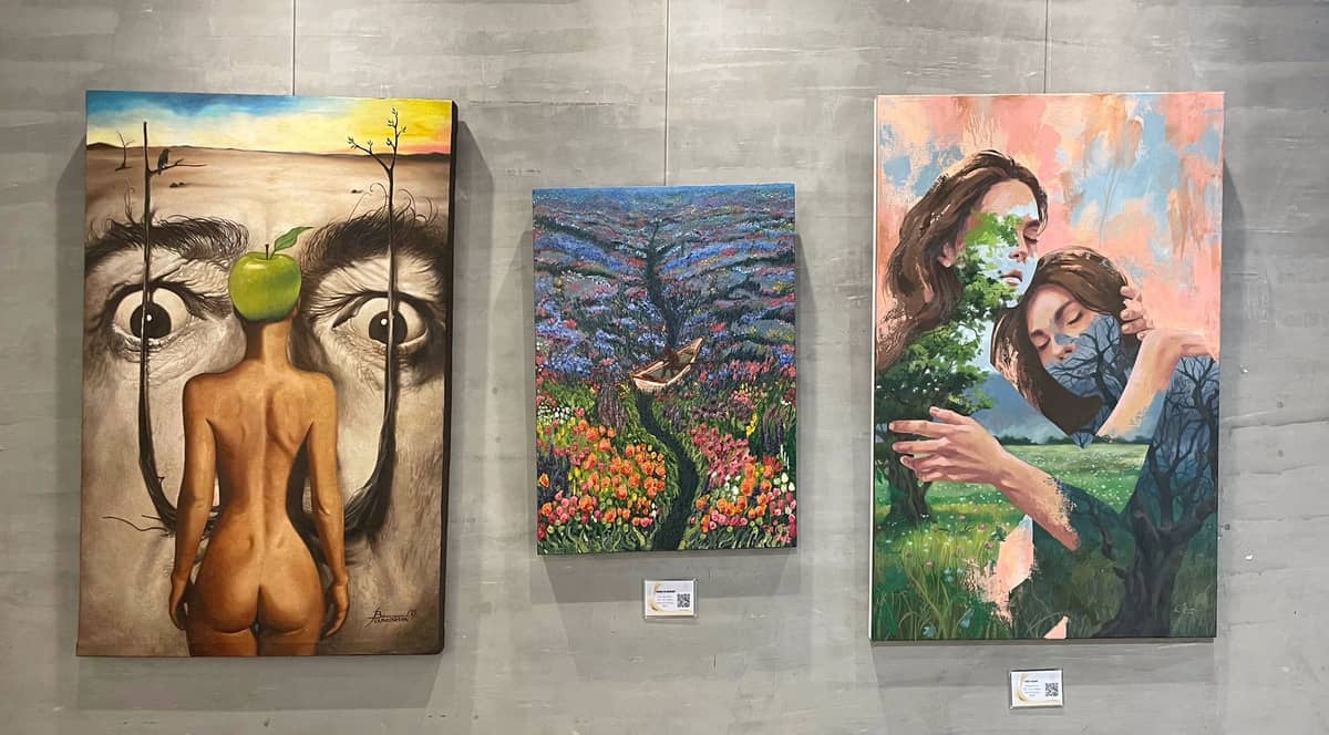 Abe Orobia with Jessa Desoloc and her artwork at the 'Symbiosis' exhibition at J Studio in Chino Roces, Makati.