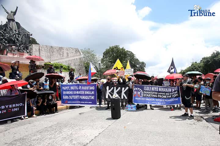 Rallyists converged at the People Power Monument in Ortigas Avenue on Saturday to hit corrupt officials in the controversial flood control projects.