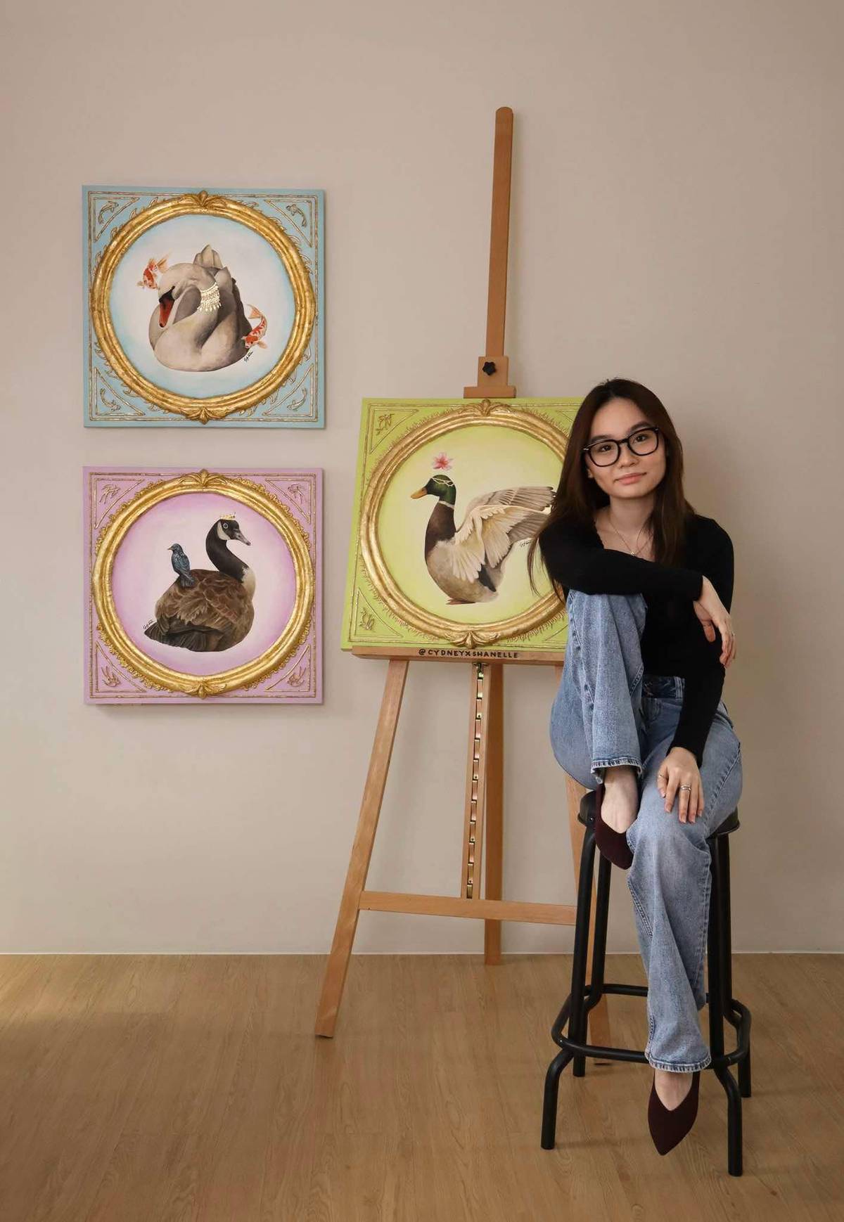 Cydney Shanelle with her artworks for the 'Symbiosis' exhibition.