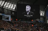 The crowd and teams hold a moment of appreciation for late boxer Ricky Hatton during the English Premier League football match between Manchester City and Manchester United at the Etihad Stadium in Manchester, north west England, on September 14, 2025.
