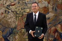 (FILES) Spain's Attonery General Alvaro Garcia Ortiz holds the Annual Report of the Attorney General’s Office prior to presenting it to the king on September 3, 2025 at La Zarzuela Palace in Madrid. The Spanish Supreme Court imposed a €150,000 bail on Attorney General Alvaro Garcia Ortiz September 9, 2025 and formally confirmed that he will stand trial for alleged violation of judicial secrecy, in an awkward case for the government of Socialist Pedro Sánchez, who appointed him.