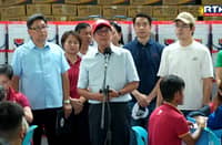 Marcos aids fire victims, inks disaster response law