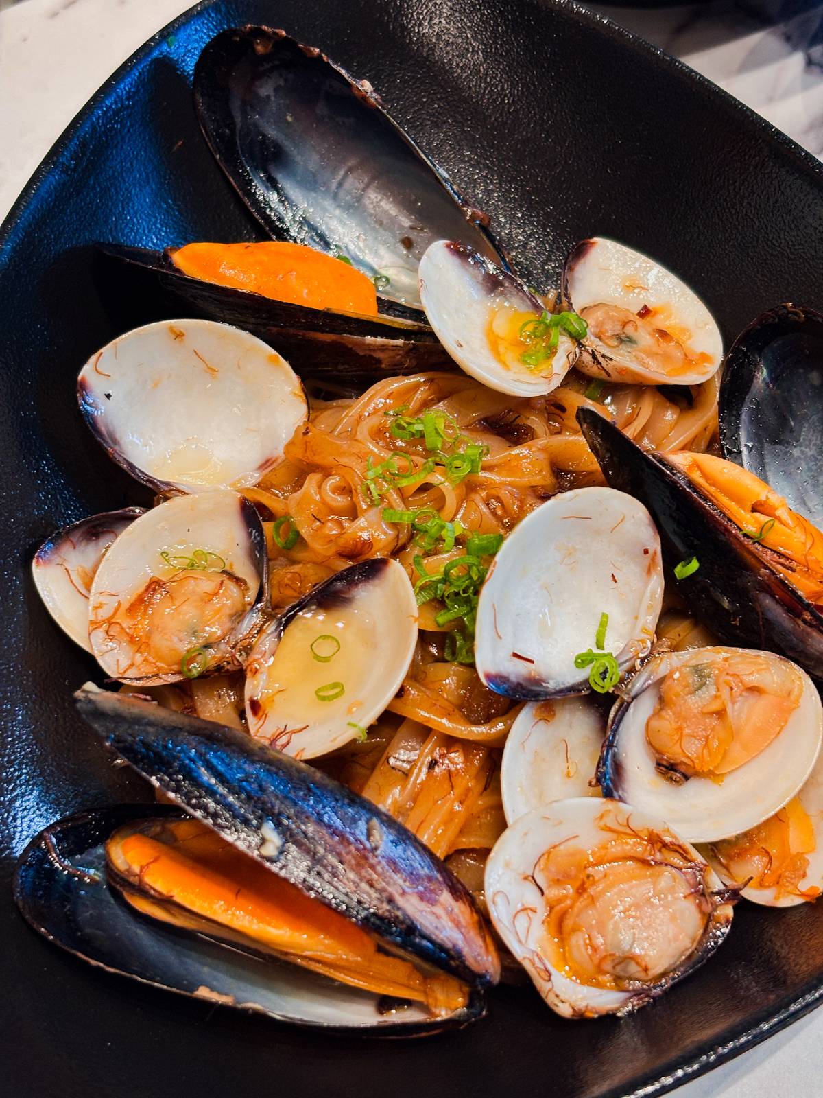 Hofan, with clams, mussels, XO sauce.