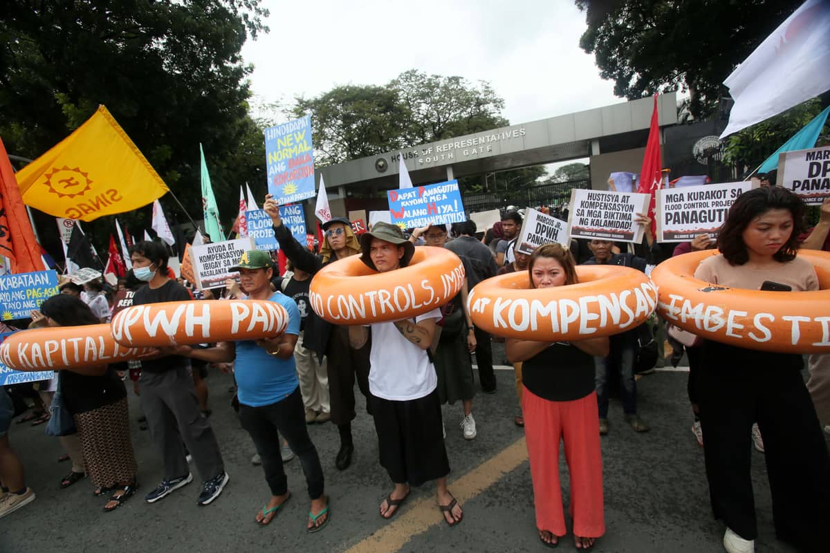 Militant group stages a protest in front of the House of Representatives on Quezon City to condemn the leading role of the DPWH in the anomalous flood control projects and widespread corruption in the government’s infrastructure program.
