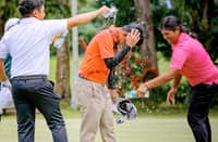 RAFELLA Batican (right) celebrates by dousing her brother Ralph with water after the siblings scored a double victory at the ICTSI Bacolod Junior PGT Championship at Bacolod Golf and Country Club.