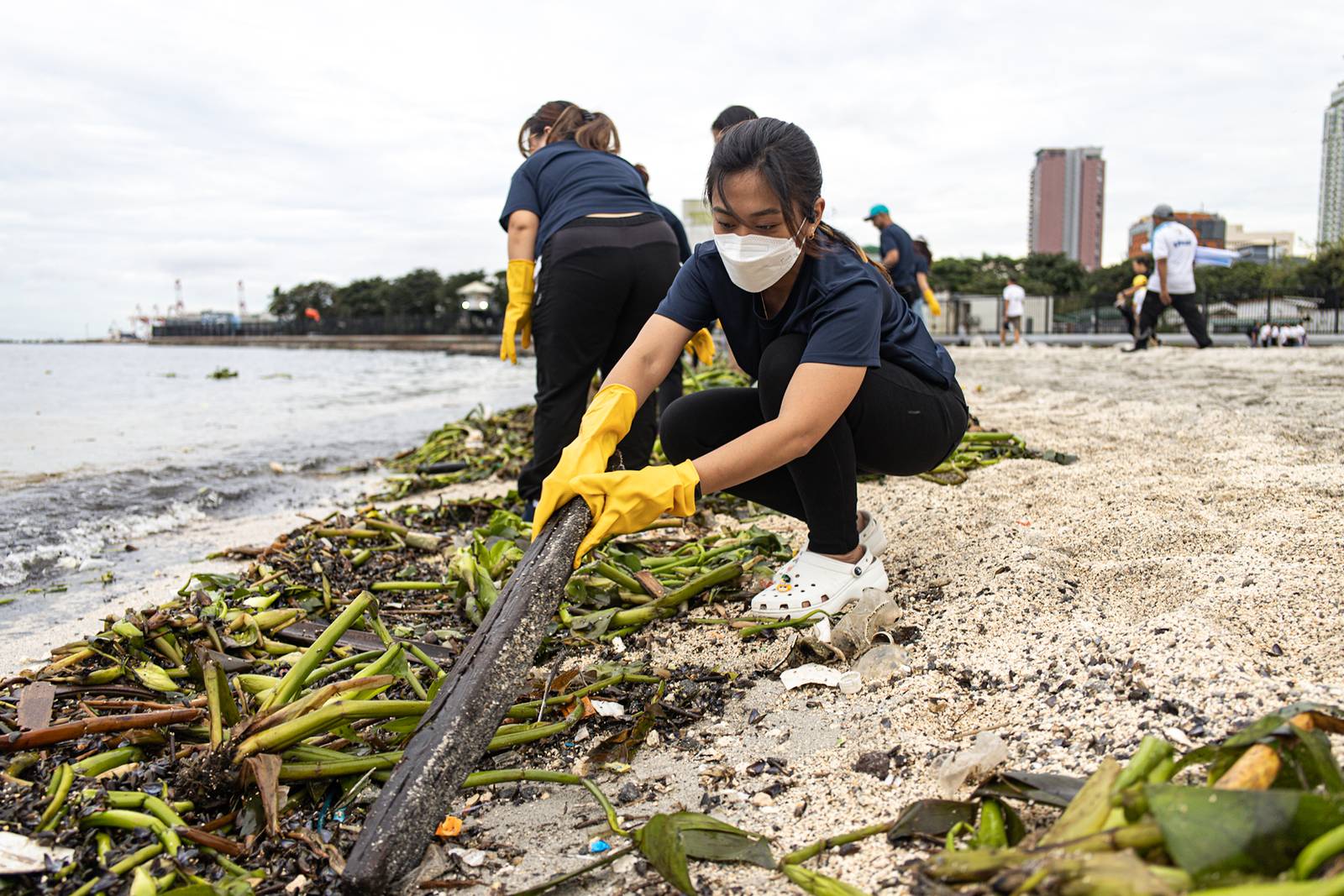 Around 4,000 volunteers pick up trash floating in and around the dolomite beach in Manila Bay on Saturday, 20 September 2025, in observance of International Coastal Clean-Up Day.