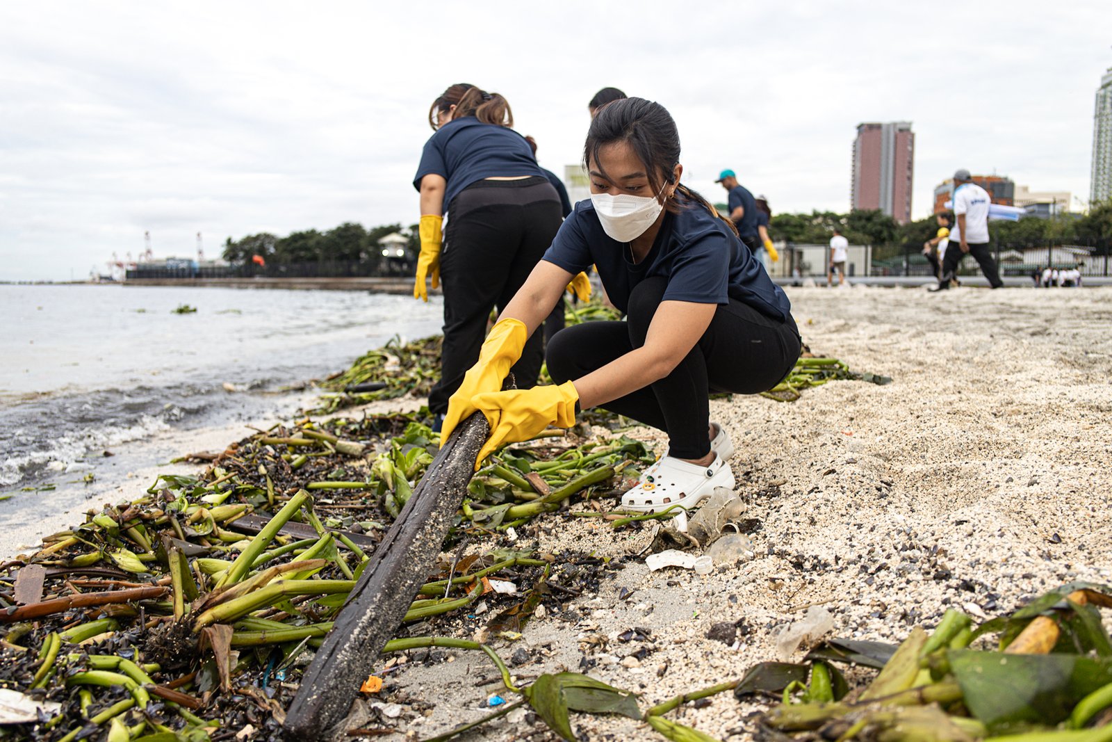 Around 4,000 volunteers pick up trash floating in and around the dolomite beach in Manila Bay on Saturday, 20 September 2025, in observance of International Coastal Clean-Up Day.