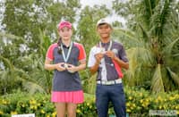 TASHANAH Balangauan and John Rey Oro display their medals after ruling the 15-18 division of the ICTSI Bacolod Junior PGT Championship at the Bacolod Golf and Country Club on Saturday.