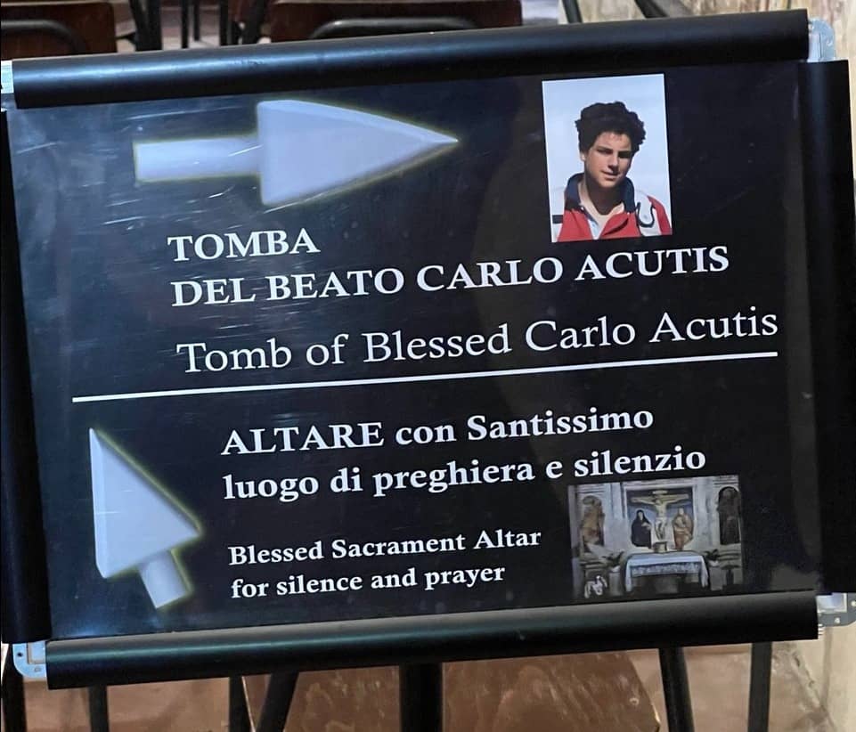 Millennial Saint: A signage to his tomb.