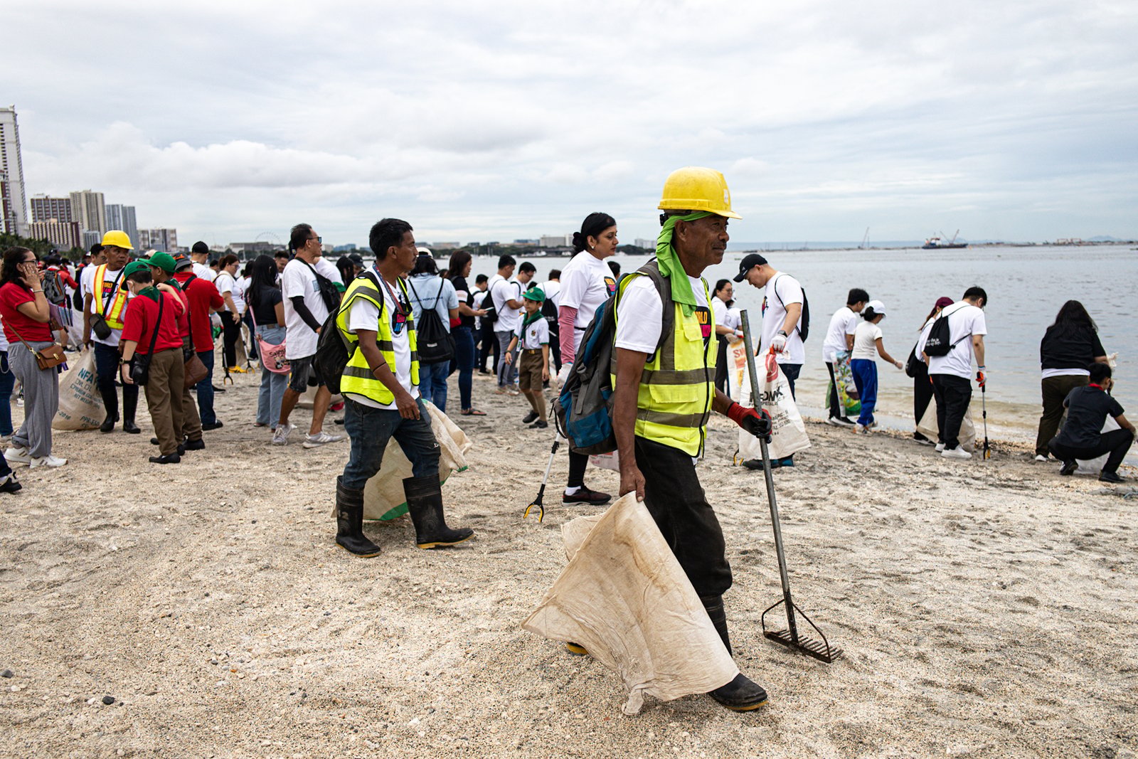 Around 4,000 volunteers pick up trash floating in and around the dolomite beach in Manila Bay on Saturday, 20 September 2025, in observance of International Coastal Clean-Up Day.