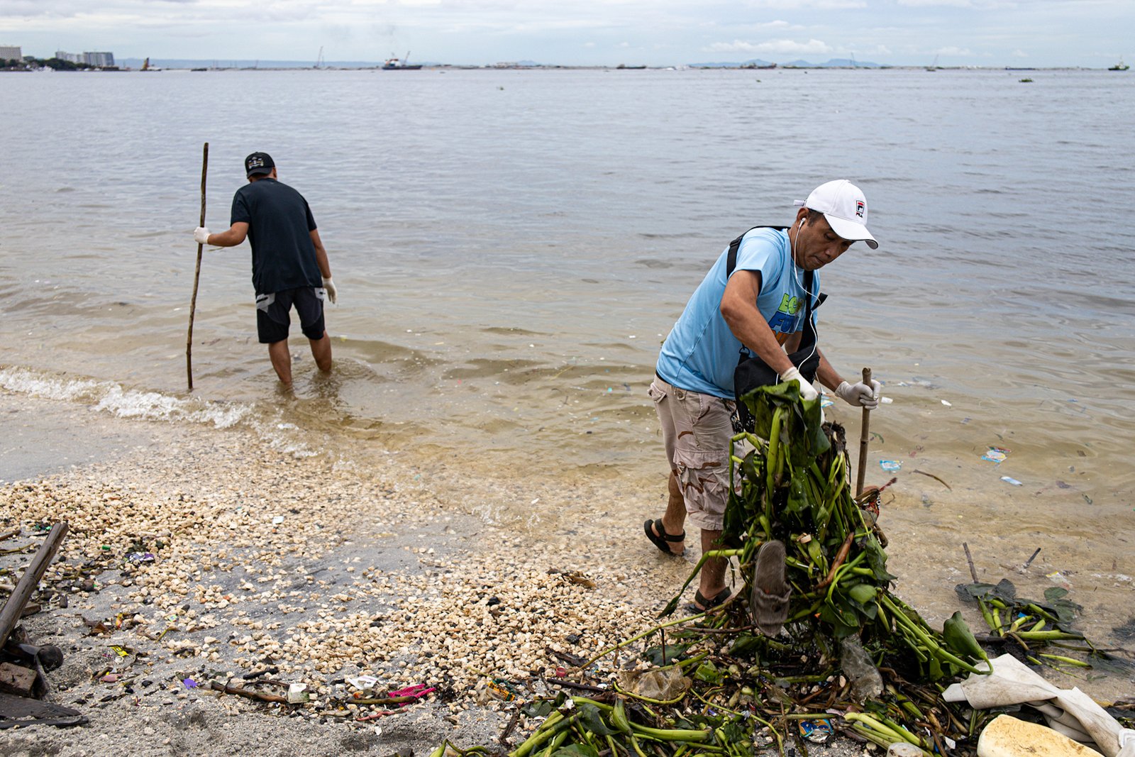 Around 4,000 volunteers pick up trash floating in and around the dolomite beach in Manila Bay on Saturday, 20 September 2025, in observance of International Coastal Clean-Up Day.