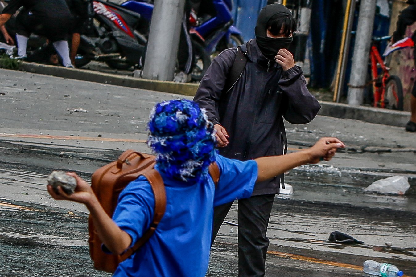 IN PHOTOS: Various progressive groups from different sectors marched down from the pilot rally area in Luneta to Mendiola Peace Arch to protest the irregularities and anomalies in governance on Sunday, 21 September, 2025.  Tensions that turned into a violent dispersal follows as a truck container and police barricade restricted protesters from crossing Ayala Bridge that caused the truck and a motorcycle to be set on fire. 

In Mendiola, a series of stampedes, tear gas explosions, and riot with the police were also seen till night as protesters threw solid objects to resist with the police barricade. Disrupting sounds were also heard playing through the city's speakers. 

Some attendees involved in the protest were arrested by authorities.|Aram Lascano