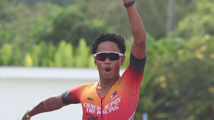 ERYK Omandam celebrates as he crosses the finish line to formalize his victory in the Damosa Land 5150 Triathlon in Samal Island on Sunday.