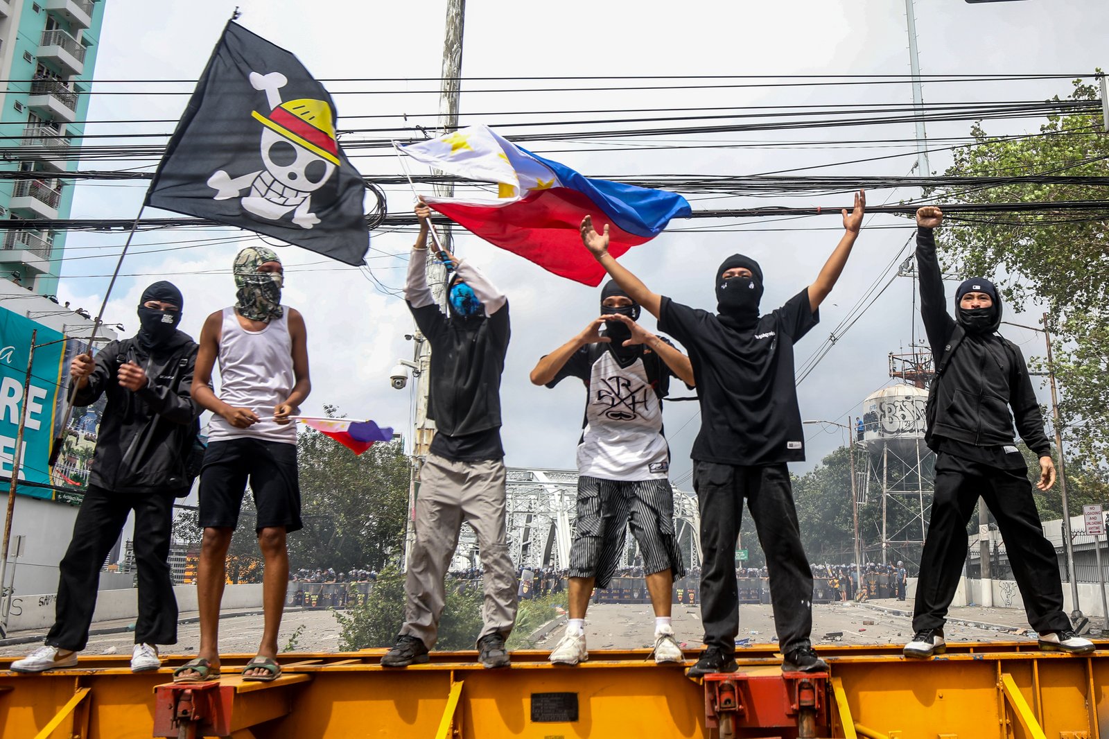IN PHOTOS: Various progressive groups from different sectors marched down from the pilot rally area in Luneta to Mendiola Peace Arch to protest the irregularities and anomalies in governance on Sunday, 21 September, 2025.  Tensions that turned into a violent dispersal follows as a truck container and police barricade restricted protesters from crossing Ayala Bridge that caused the truck and a motorcycle to be set on fire. 

In Mendiola, a series of stampedes, tear gas explosions, and riot with the police were also seen till night as protesters threw solid objects to resist with the police barricade. Disrupting sounds were also heard playing through the city's speakers. 

Some attendees involved in the protest were arrested by authorities.|Aram Lascano