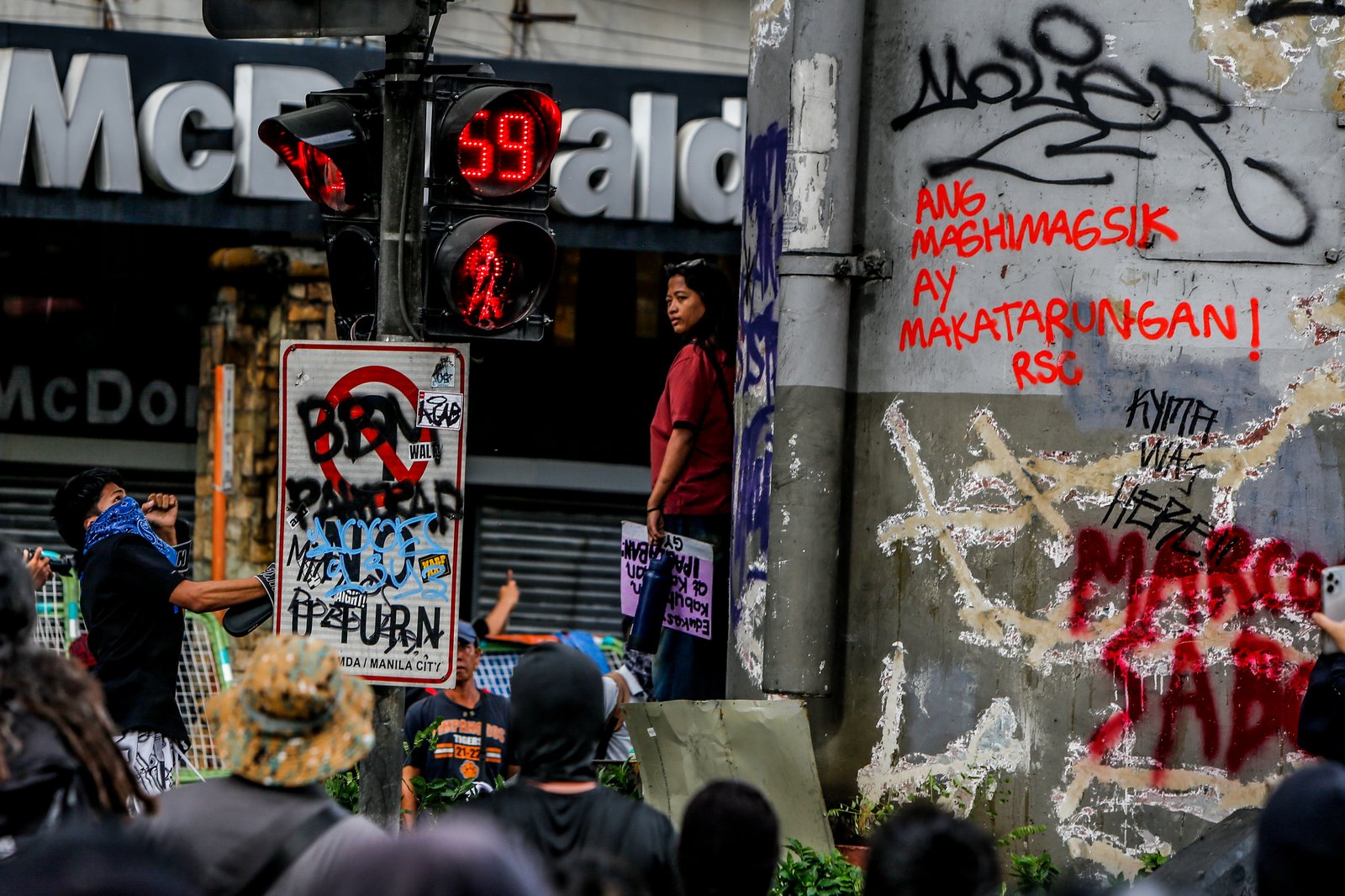 IN PHOTOS: Various progressive groups from different sectors marched down from the pilot rally area in Luneta to Mendiola Peace Arch to protest the irregularities and anomalies in governance on Sunday, 21 September, 2025.  Tensions that turned into a violent dispersal follows as a truck container and police barricade restricted protesters from crossing Ayala Bridge that caused the truck and a motorcycle to be set on fire. 

In Mendiola, a series of stampedes, tear gas explosions, and riot with the police were also seen till night as protesters threw solid objects to resist with the police barricade. Disrupting sounds were also heard playing through the city's speakers. 

Some attendees involved in the protest were arrested by authorities.|Aram Lascano