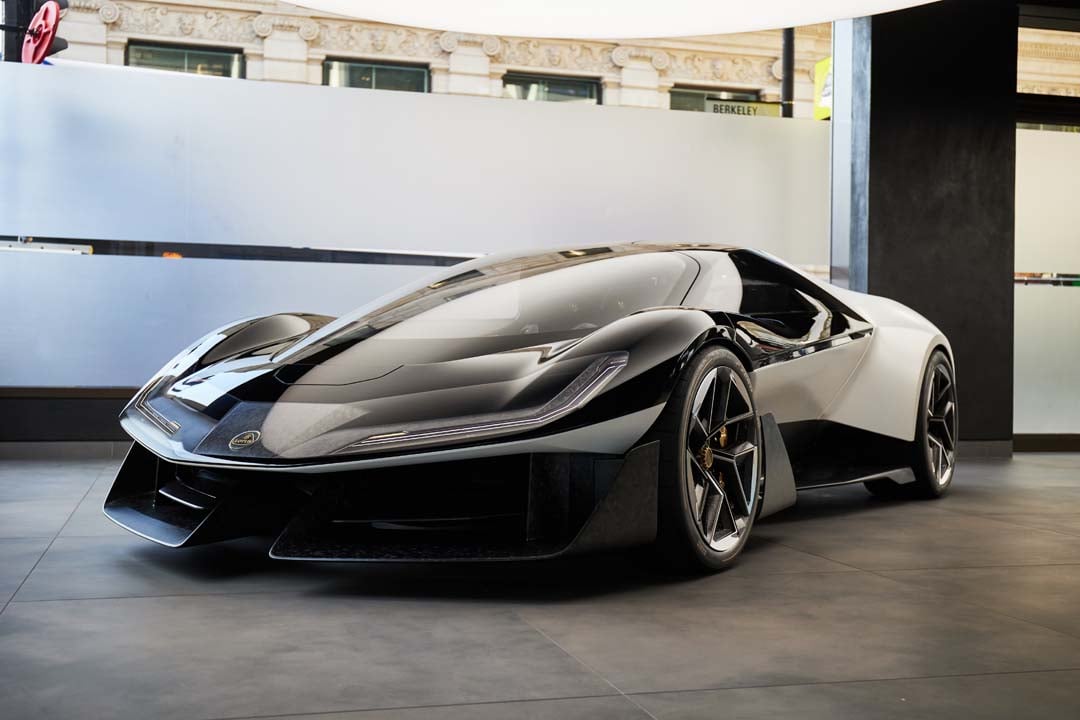 The Lotus Theory 1 concept is on display, highlighting its low-profile shape.