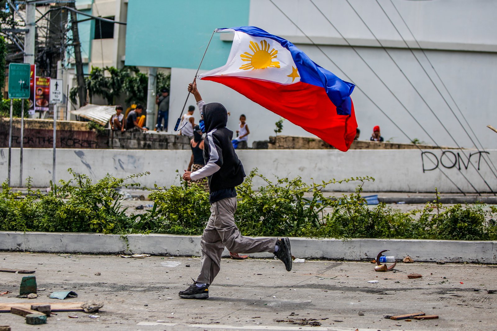 IN PHOTOS: Various progressive groups from different sectors marched down from the pilot rally area in Luneta to Mendiola Peace Arch to protest the irregularities and anomalies in governance on Sunday, 21 September, 2025.  Tensions that turned into a violent dispersal follows as a truck container and police barricade restricted protesters from crossing Ayala Bridge that caused the truck and a motorcycle to be set on fire. 

In Mendiola, a series of stampedes, tear gas explosions, and riot with the police were also seen till night as protesters threw solid objects to resist with the police barricade. Disrupting sounds were also heard playing through the city's speakers. 

Some attendees involved in the protest were arrested by authorities.|Aram Lascano