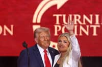 US President Donald Trump and Erika Kirk, Charlie Kirk's widow, gesture during the public memorial service for right-wing activist Charlie Kirk at State Farm Stadium in Glendale, Arizona, on September 21, 2025.