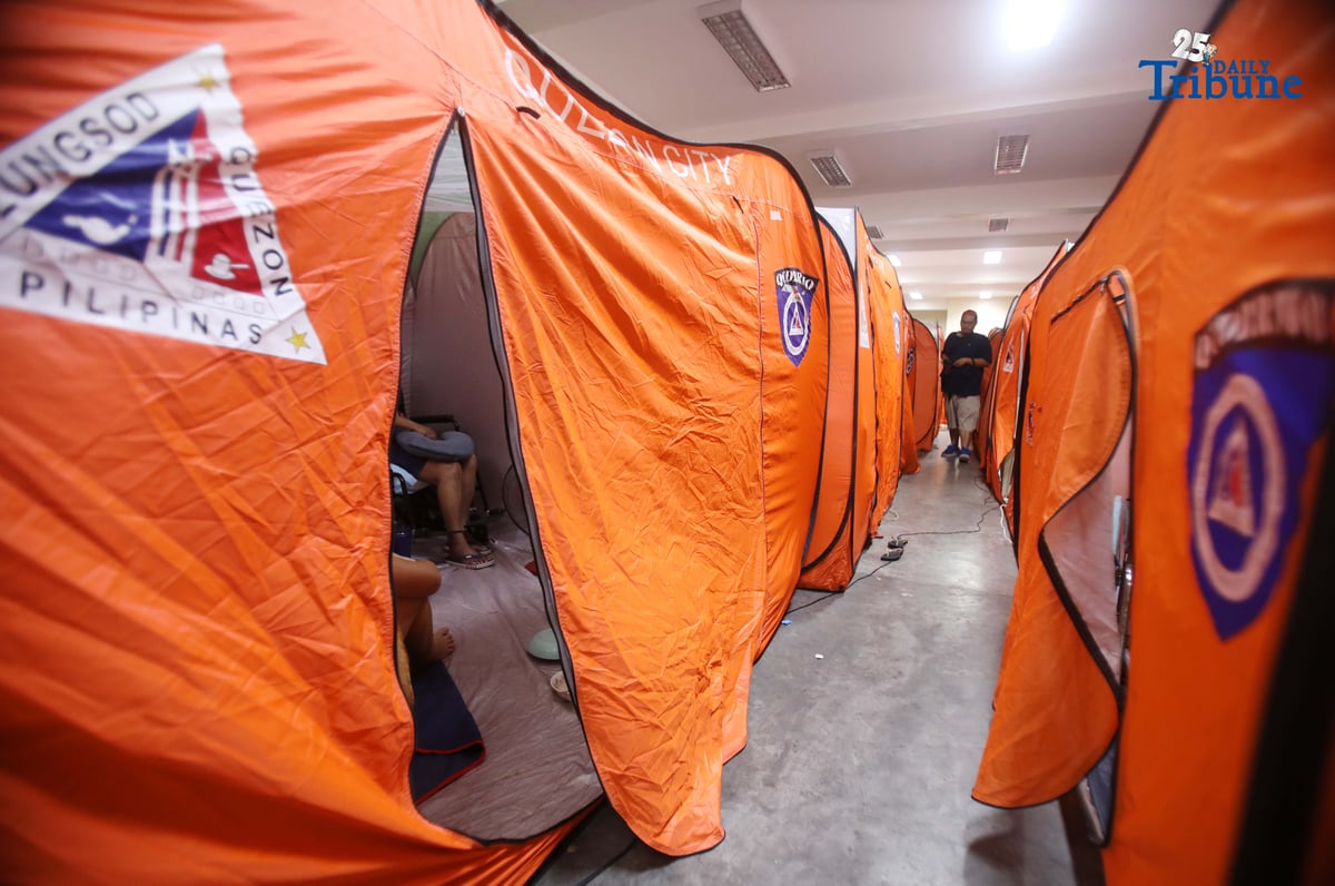 (September 23 2025) Families resident near the creek at Roxas District in Quezon City sought temporary shelter at the Roxas District Evacuation Center in Quezon City on Tuesday, September 23, 2025, following the Quezon City government’s order for pre-emptive evacuation in flood-prone areas due to Super Typhoon “Nando.” Photo/Analy Labor