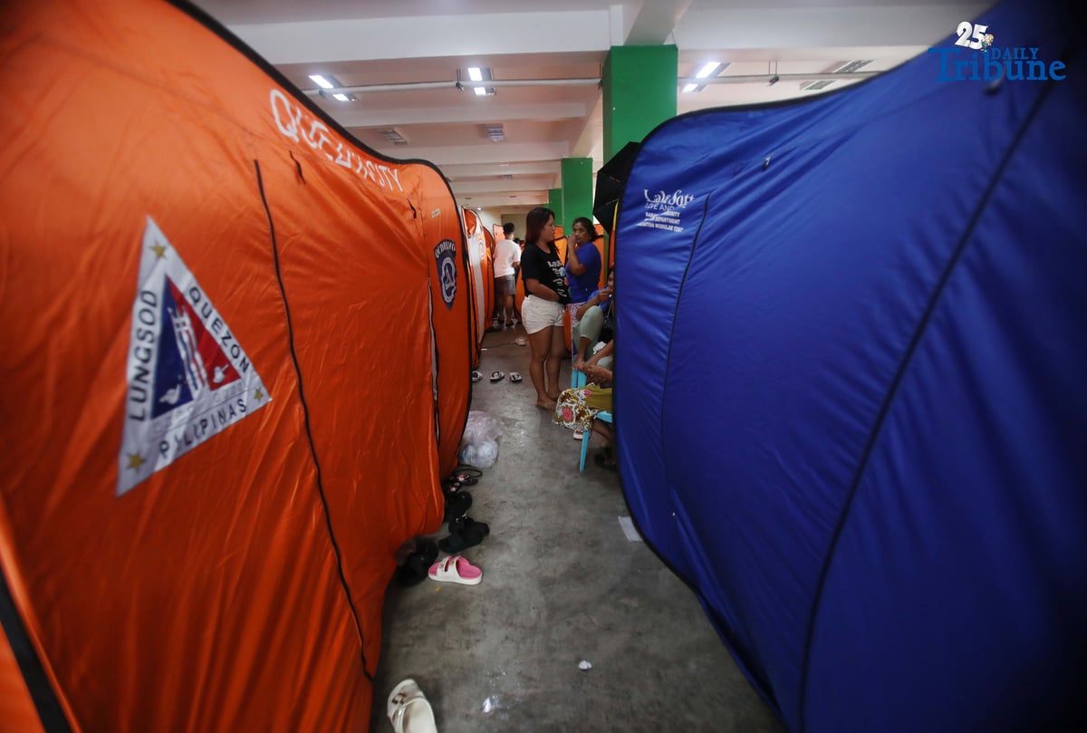 (September 23 2025) Families resident near the creek at Roxas District in Quezon City sought temporary shelter at the Roxas District Evacuation Center in Quezon City on Tuesday, September 23, 2025, following the Quezon City government’s order for pre-emptive evacuation in flood-prone areas due to Super Typhoon “Nando.” Photo/Analy Labor