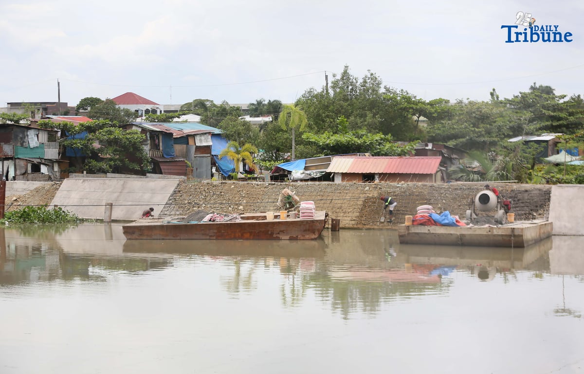(September 23 2025) Workers from the contractors of Department of Public Works and Highways (DPWH) Bulacan 1st District Engineering Office (DEO) were seen busy working the concrete laying on the riverbank protection structure along a river at Barangay Santa Cruz in Guiguinto, Bulacan on Friday September 19 2025. At the senate hearing held on Tuesday September 23 2025, former assistant district engineer Brice Hernandez said, From at least 2019 to 2025, or for the last six years, all Department of Public Works and Highways (DPWH) projects in the first district of Bulacan have been substandard, or at the very least “under-designed,” Photo/Analy Labor