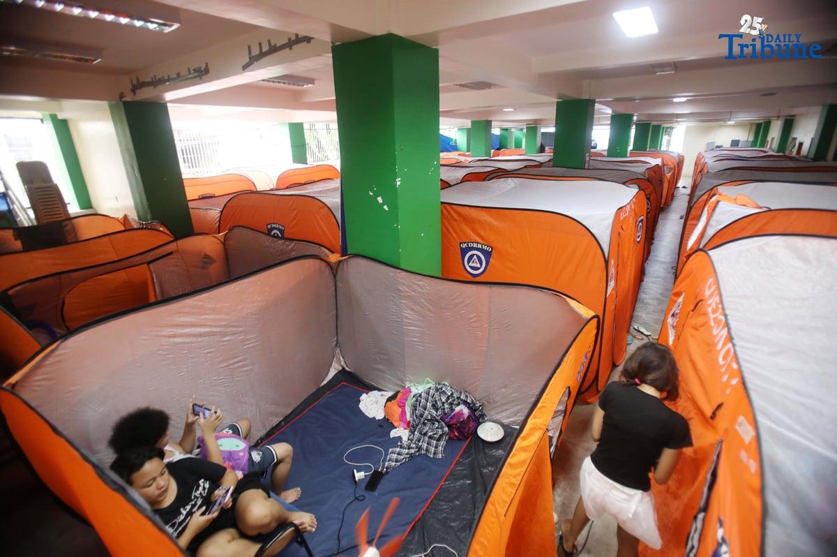 (September 23 2025) Families resident near the creek at Roxas District in Quezon City sought temporary shelter at the Roxas District Evacuation Center in Quezon City on Tuesday, September 23, 2025, following the Quezon City government’s order for pre-emptive evacuation in flood-prone areas due to Super Typhoon “Nando.” Photo/Analy Labor