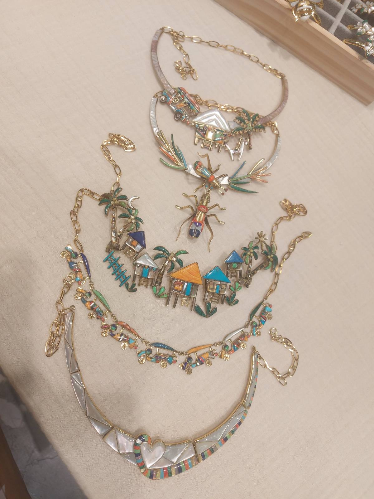 JEEPNEY necklace with moving wheels.