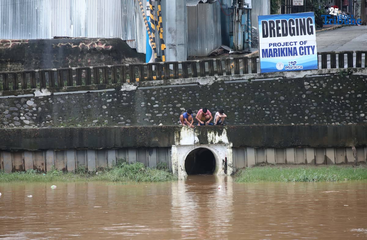 People were seen fishing along the Marikina River at Marikina River Park on Friday, September 26, 2025, as Typhoon Opong weakened into a severe tropical storm.
Opong, previously classified as a typhoon, was downgraded by PAGASA, which warned the public to remain on alert for possible hazards, including floods, landslides, and storm surges.