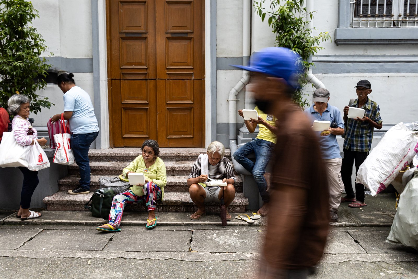 Individuals wait in line to receive food packs during a feeding program organized by a private group at San Vicente de Paul Parish in Manila on Saturday, 27 September 2025.

President Ferdinand Marcos Jr. ordered Friday the transfer of the Department of Public Works and Highways’ ₱36 billion flood control budget for 2026 to the Department of Social Welfare and Development to fund its programs, including the Assistance to Individuals in Crisis Situation (AICS), the Sustainable Livelihood Program, and the Pantawid Pamilyang Pilipino Program (4Ps).