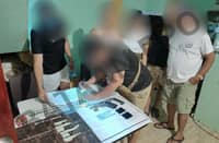 Mariveles Police conduct inventory on the confiscated loose firearm and shabu worth P98,000 in De Guzman Blvd., Brgy. Poblacion, Mariveles from the two suspects.