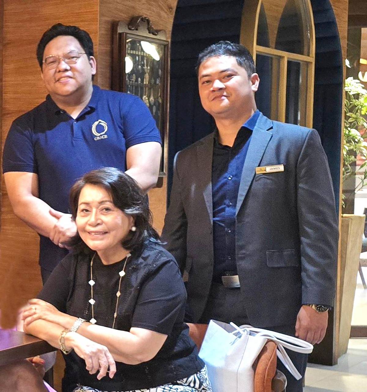 Nelia Neri with RAQ Golden Group-executive VP Aaron Jeremy Que and GM of Golden Prince Hotel and Suites Arthur Fernandez.