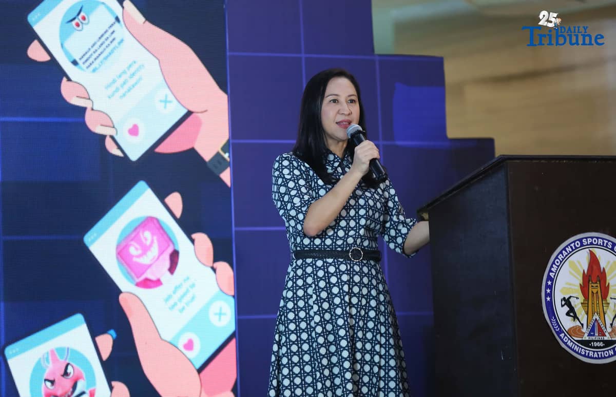 Quezon City Mayor Joy Belmonte speaks during the launch of the “BE WAIS” Community Guides, a joint initiative with Meta, Bayan Academy, and the Ateneo Office for Social Concern and Involvement (Ateneo-OSCI), at the Amoranto Sports Complex in Quezon City. The BE WAIS Guides are designed to help communities combat online fraud, scams, misinformation, and disinformation.