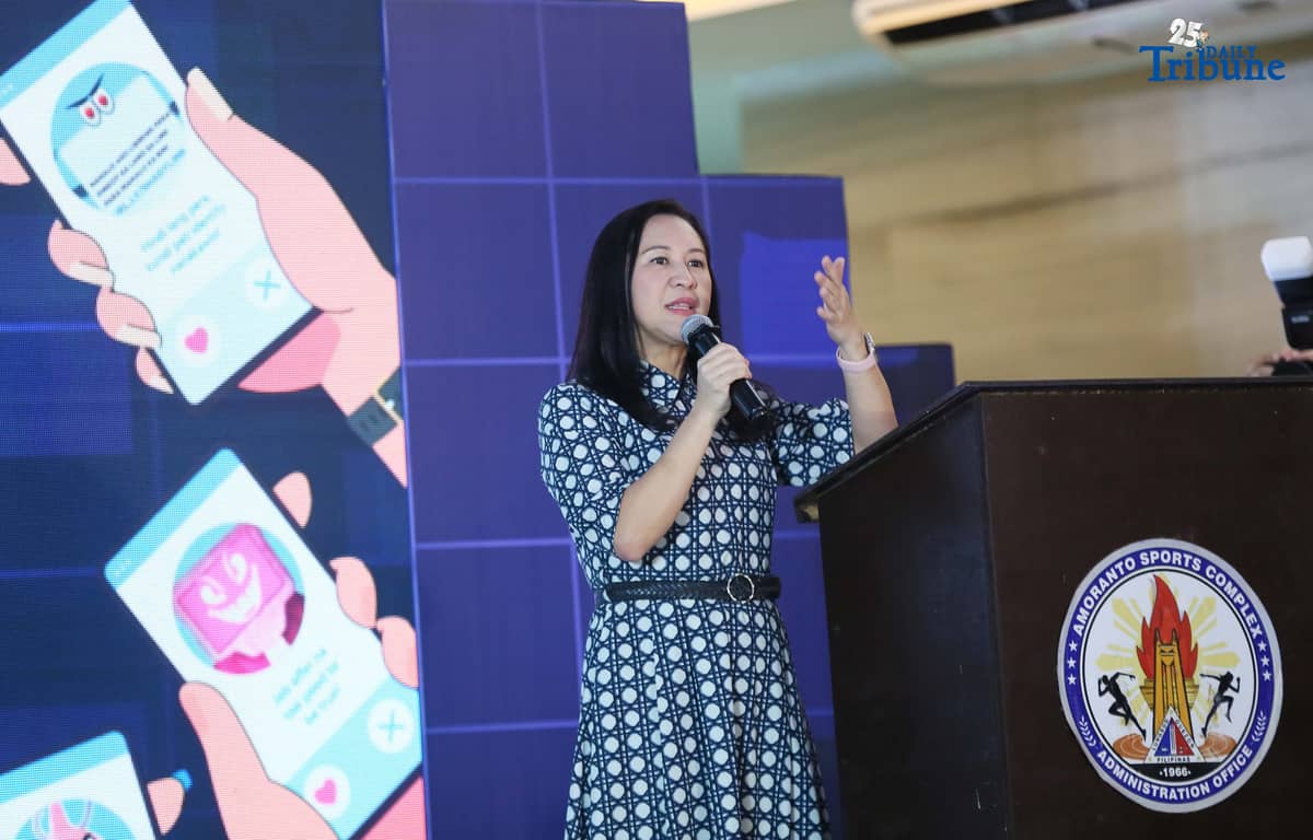 Quezon City Mayor Joy Belmonte speaks during the launch of the “BE WAIS” Community Guides, a joint initiative with Meta, Bayan Academy, and the Ateneo Office for Social Concern and Involvement (Ateneo-OSCI), at the Amoranto Sports Complex in Quezon City. The BE WAIS Guides are designed to help communities combat online fraud, scams, misinformation, and disinformation.