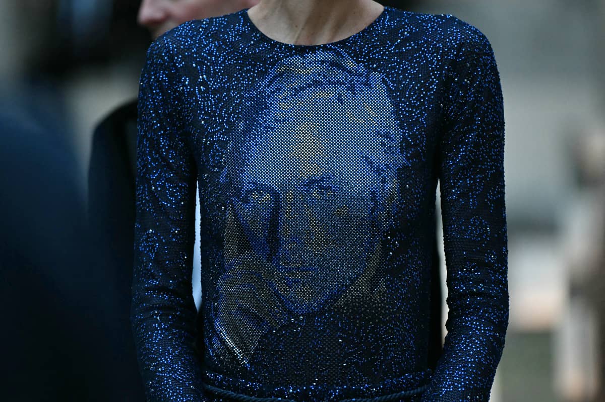 ARMANI’ s image on a shirt.