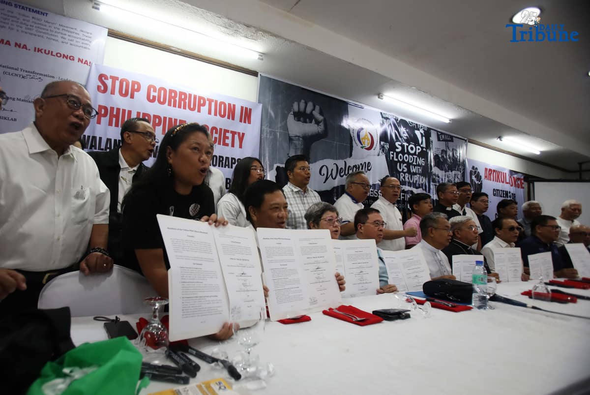 (Oct. 1, 2025) Church leaders led by Caritas Philippines President Bishop Jose Colin Bagaforo of Kidapawan and Evangelical Churches of the Philippines Bishop Efraim Tendero sign a manifesto against massive corruption during the launch of the Trillion Peso March Movement at Club Filipino, San Juan.