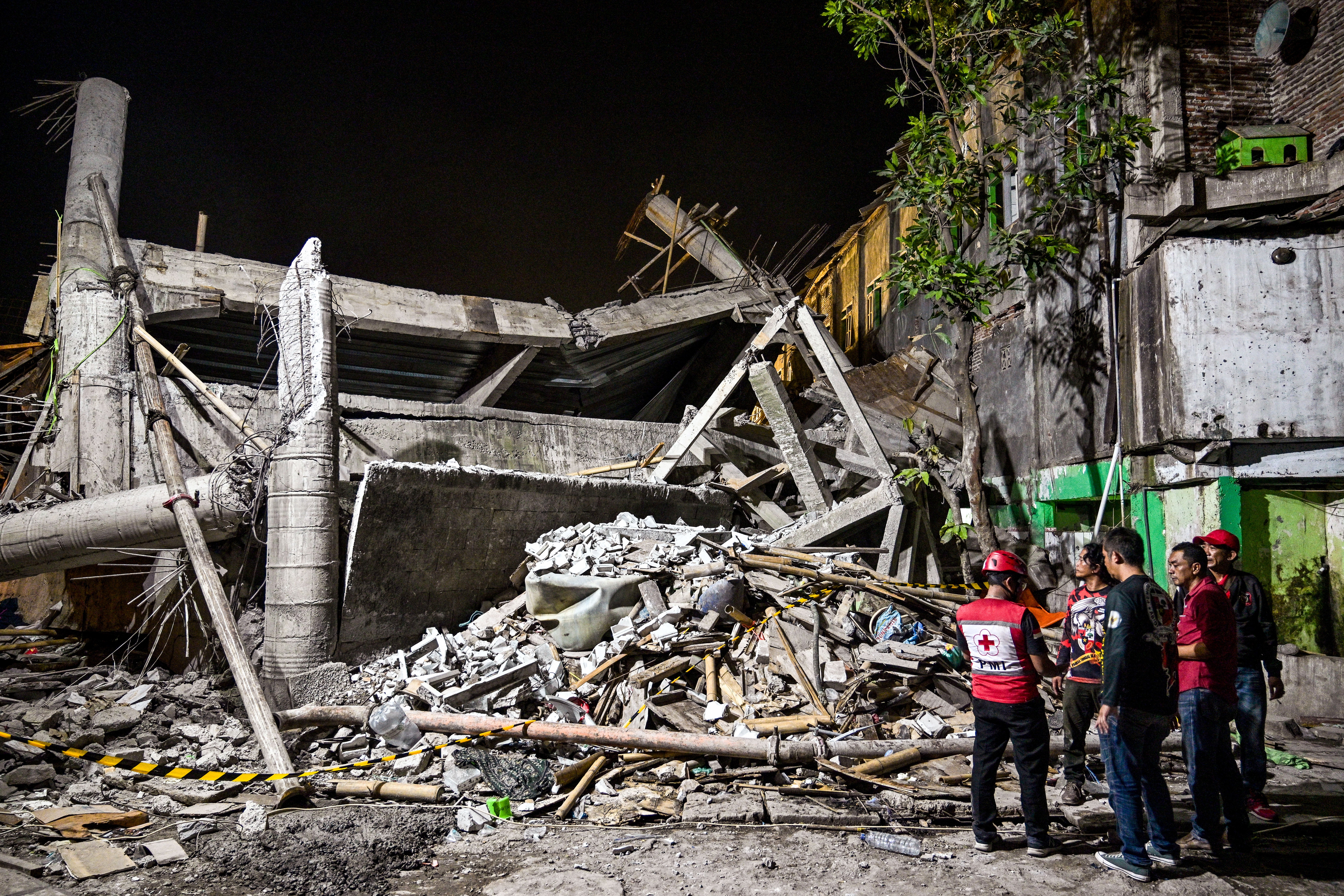 Survivor pulled from collapsed school