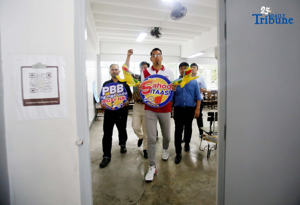 (October 03 2025) Teachers at the Justice Cecilia Munoz Palma High School,in Quezon City on Friday October 3 2025, hold a placard during their walk out protest to demand substantial salary increase, a doubled education budget, and accountability for systemic corruption that deprives schools of resources, on World Teachers’ Day, to protest against government neglect, corruption, and bureaucrat capitalism. Photo/Analy Labor