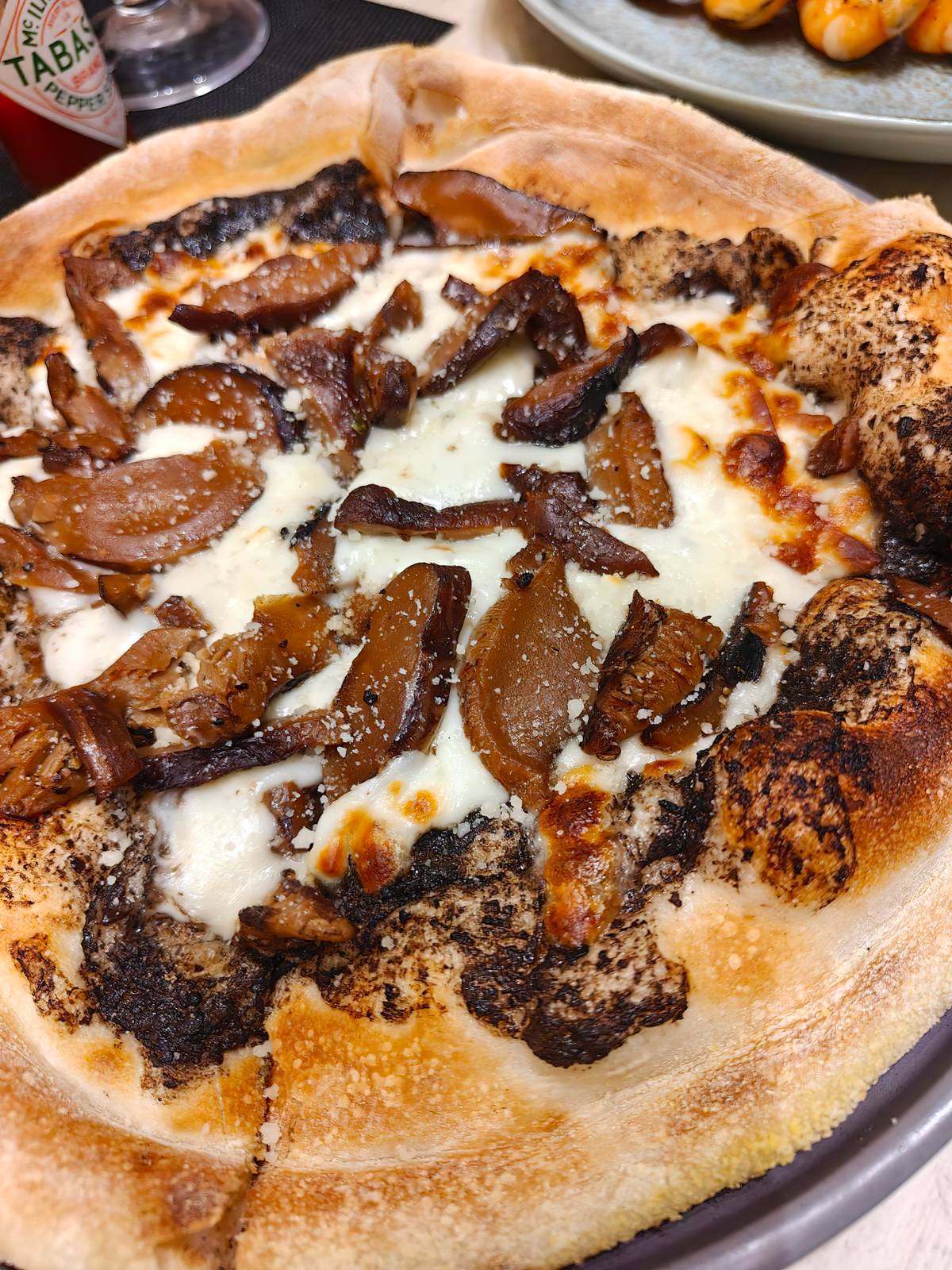 A comforting slice of perfection — truffle pizza, like a warm hug on a quiet afternoon.
