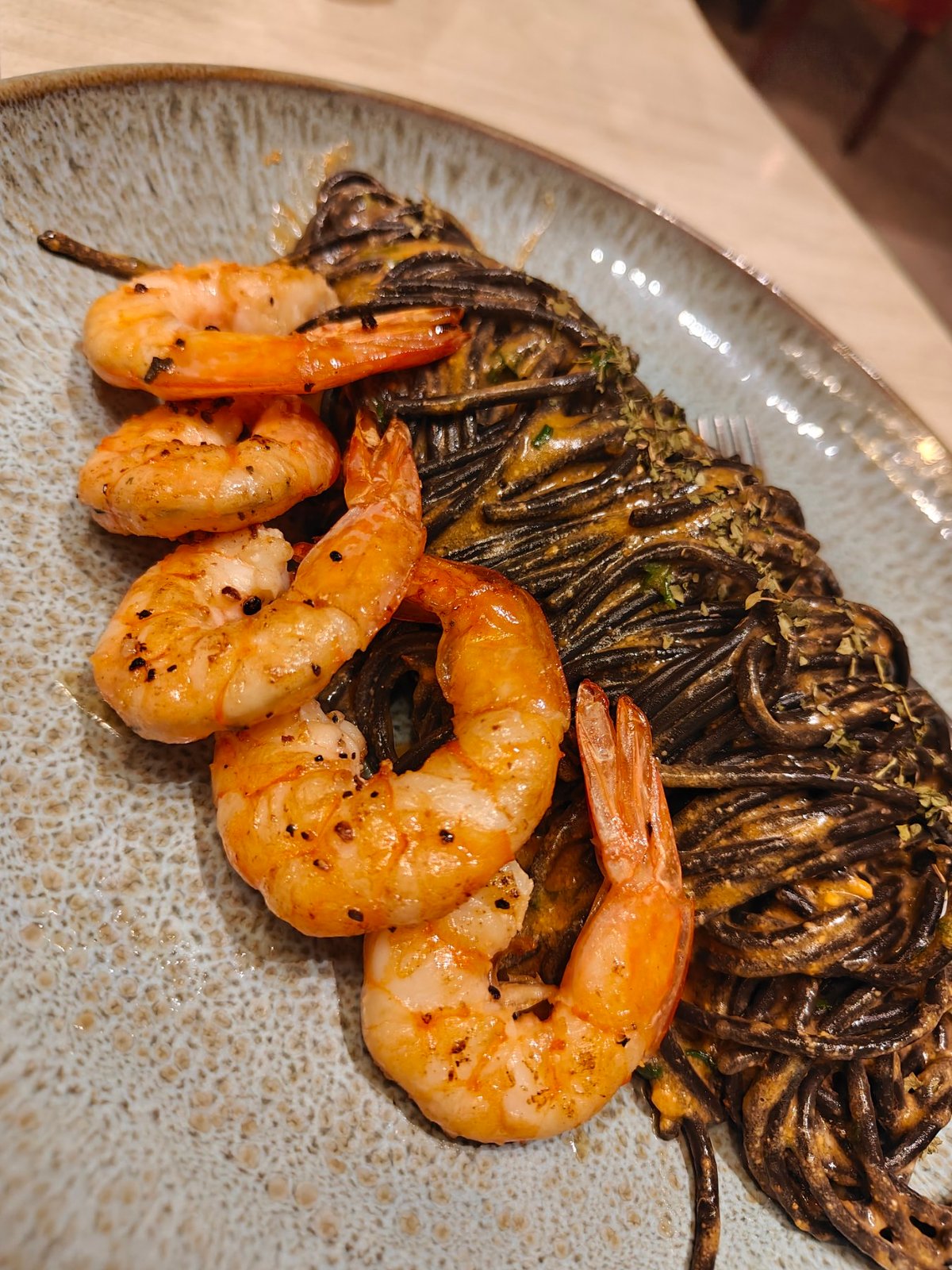 The smooth and indulgent, squid ink pasta with prawns.