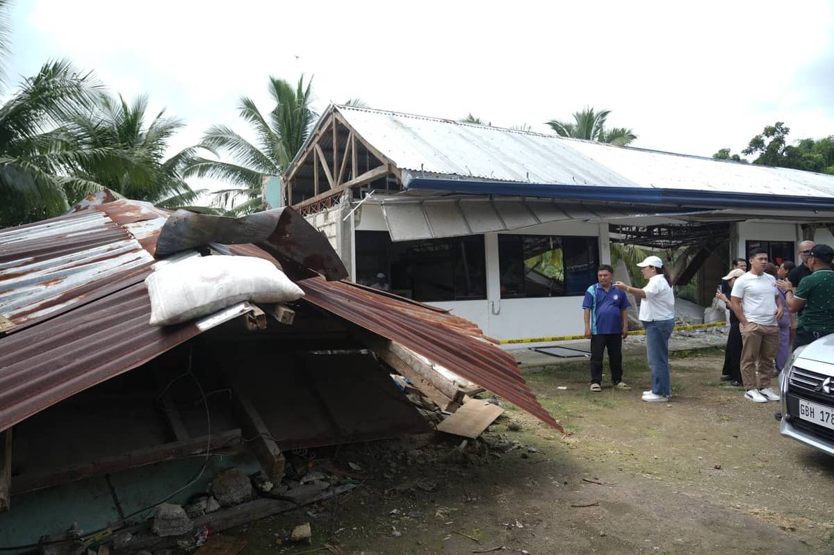 WITH aftershocks continuing, some residents (top photo) were forced to sleep outside their homes. Cebu Governor Pamela Baricuatro (lower photo) visits Barangay Kantubaon in Tabuelan, where several families — including public servants — were among the hardest hit by the recent 6.9-magnitude earthquake.