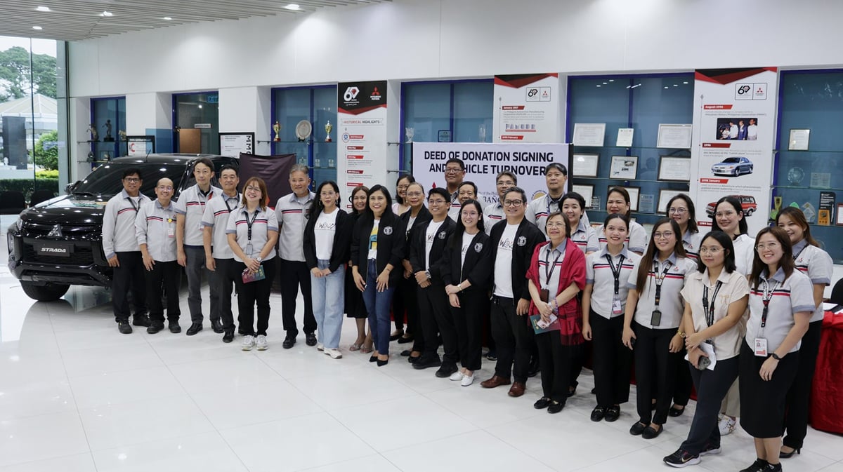 MMPC and UPLB officials gather for the signing and turnover of the Mitsubishi Strada Athlete, marking their partnership for the DUNONG Nutri-Nurture Project.
