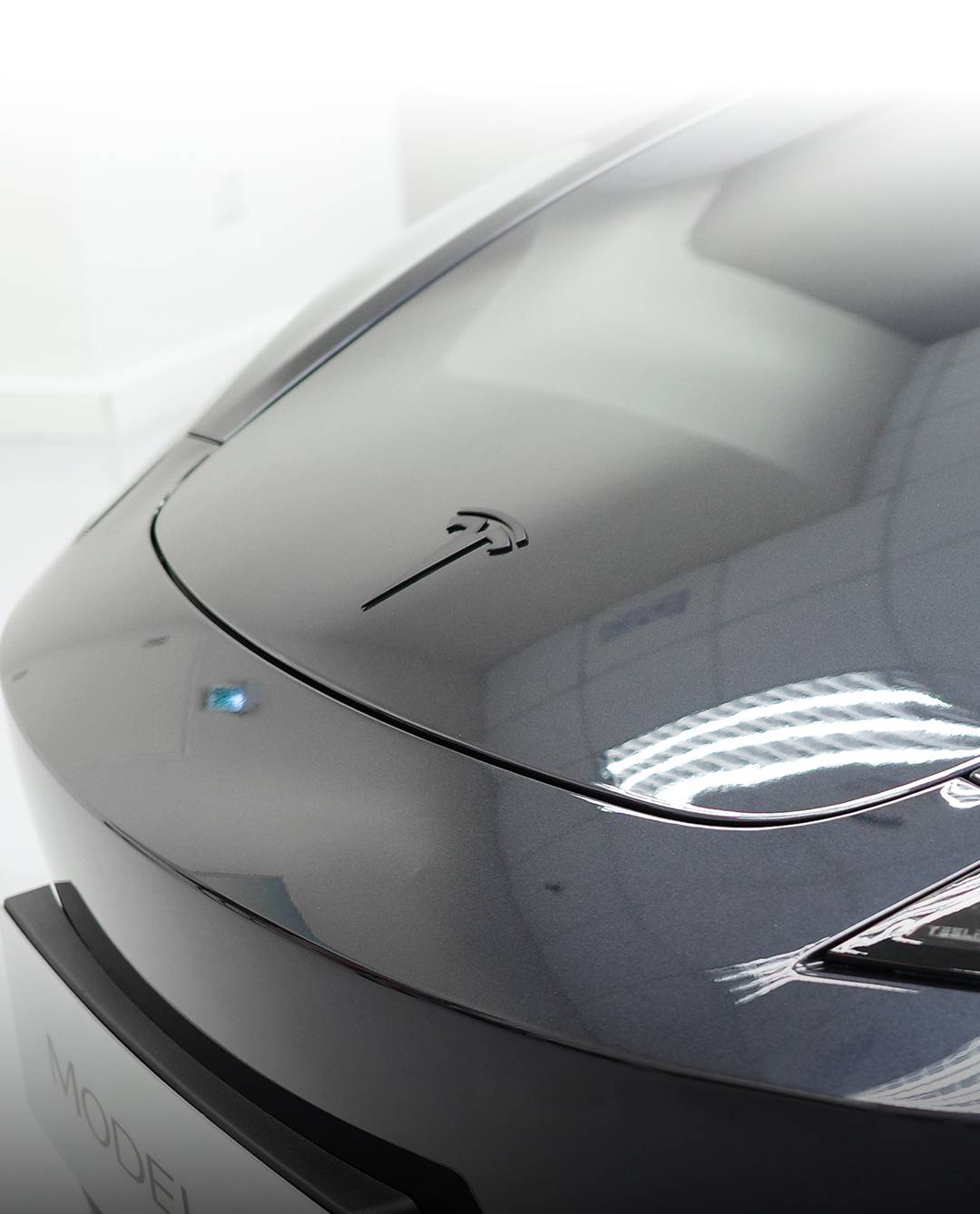 THE Tesla Model 3 now features a matte-black T-badge for a sleeker front profile.