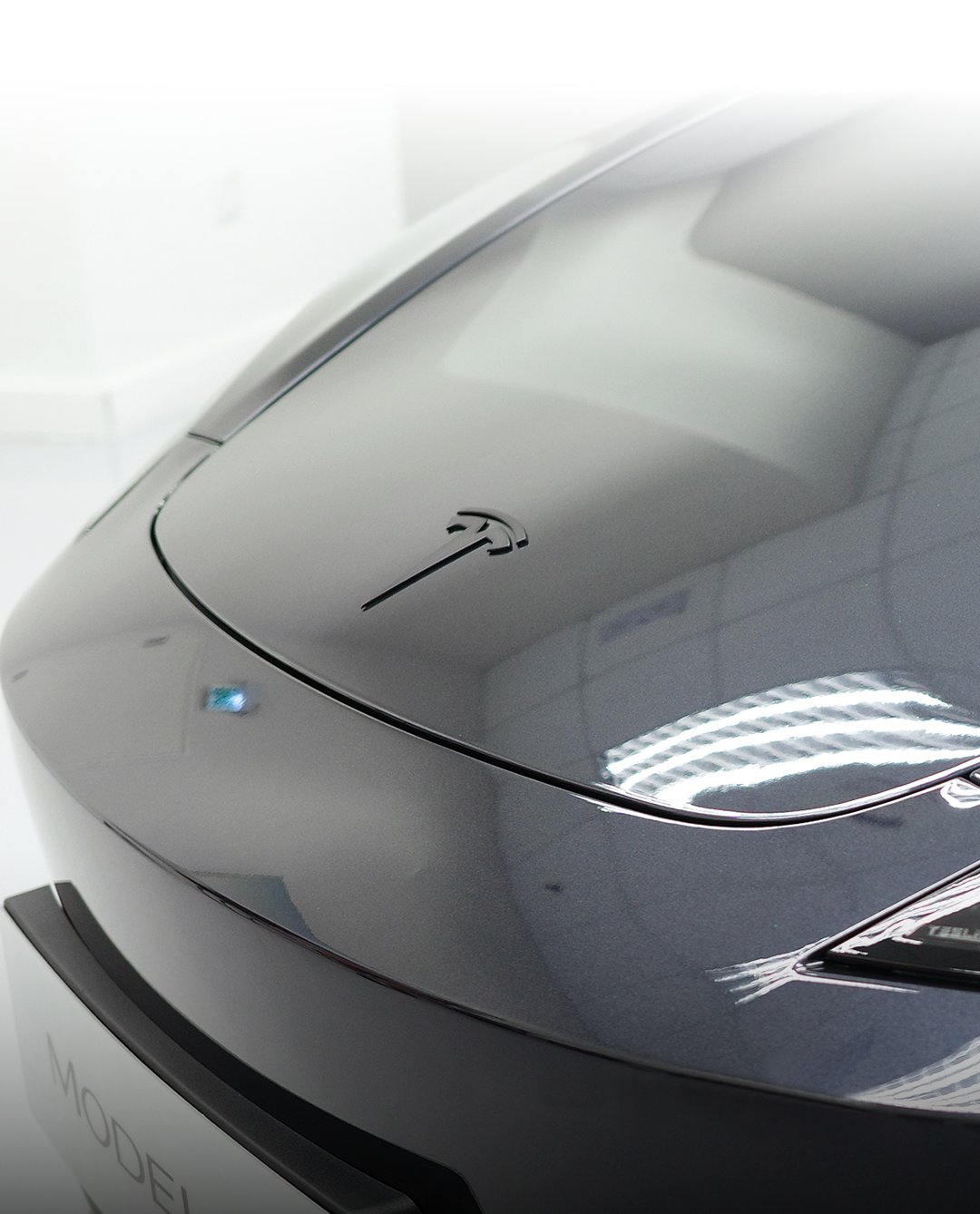 THE Tesla Model 3 now features a matte-black T-badge for a sleeker front profile.