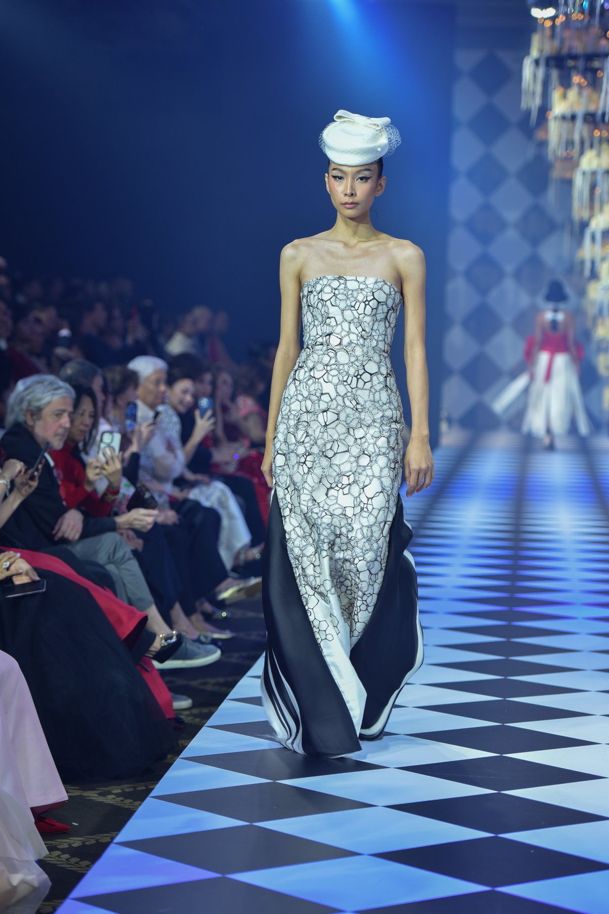 Strapless Swiss lace column gown with silk organdy panels.